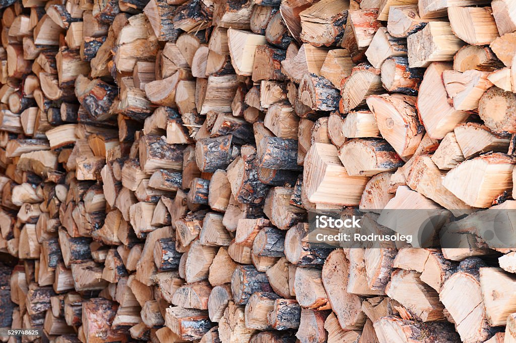 Woodpile from dry oak logs. Woodpile from dry oak logs. Selective focus. Arranging Stock Photo