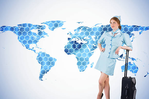 istock Composite image of pretty air hostess leaning on suitcase 529749343
