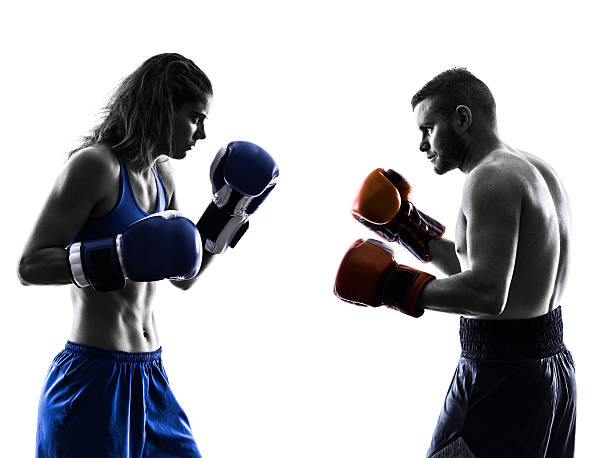 istock woman boxer boxing man kickboxing silhouette isolated 529766561