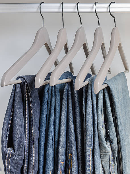 istock row of blue jeans on hangers 529767891