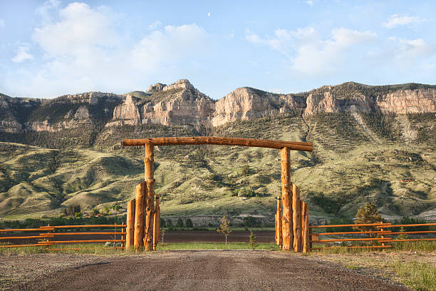 istock Ranch gate and cliffs in Wyoming, USA 529769705