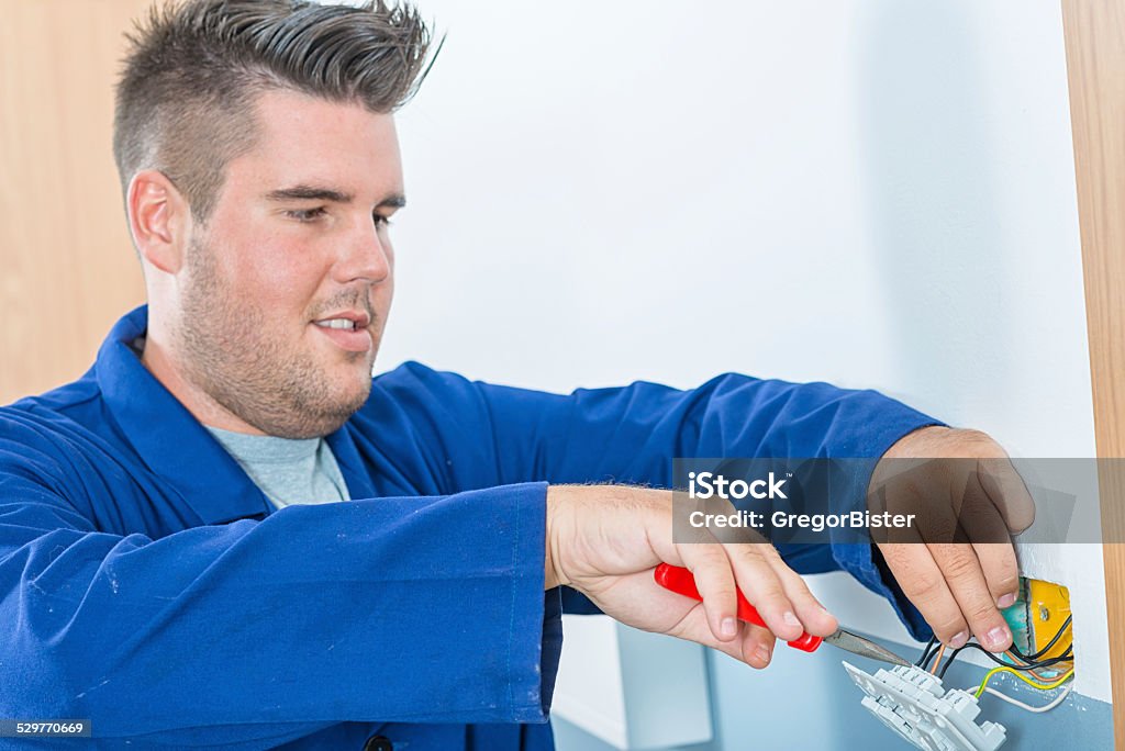 Electrician Electrician stripping cables to make them ready for connection. Close-up Stock Photo