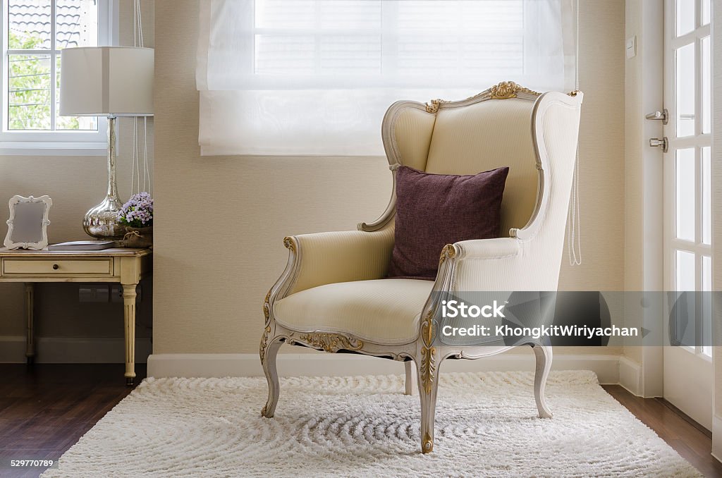 classic chair style on carpet in bedroom classic chair style on carpet in bedroom at home Bed - Furniture Stock Photo