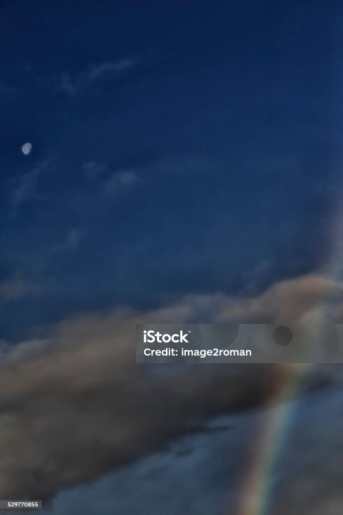 Moon and Rainbow Moon and Rainbow in a Threatening Sky - France. Altocumulus Stock Photo
