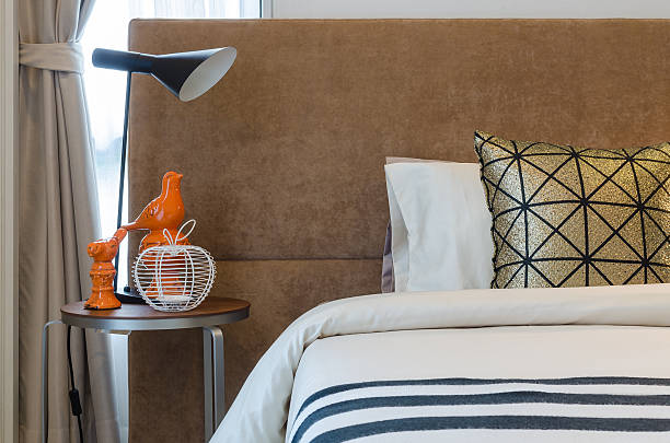 istock single bed with lamp in bedroom 529771023