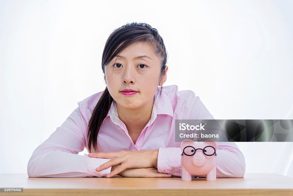 businesswoman with piggy bank Young businesswoman with a piggy bank. Adult Stock Photo