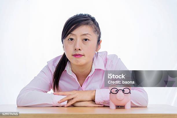 Businesswoman With Piggy Bank Stock Photo - Download Image Now - Adult, Adults Only, Asian and Indian Ethnicities