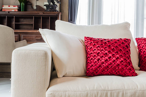 istock red and white pillow on white sofa at home 529774415
