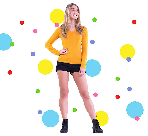 istock Composite image of stylish blonde smiling with hand on hip 529785419