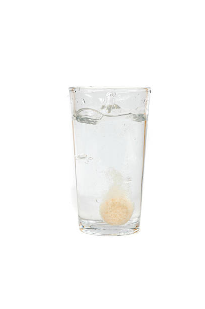 istock orange supplement tablets splashes into water drink glass 529786069