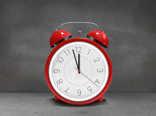 istock Composite image of alarm clock counting down to twelve 529787191