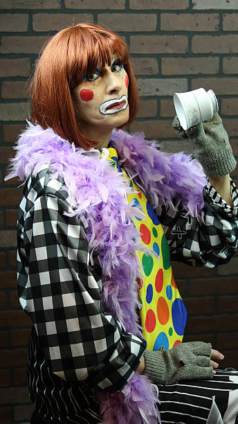 istock Female Senior Adult Clown With Empty Cup 529789119