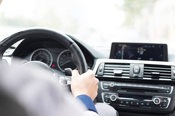 istock asian young businessman driving car 529789385