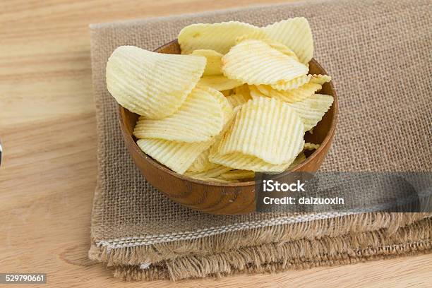 Potato Slices In A Bowl Stock Photo - Download Image Now - Bowl, Brown, Bunch