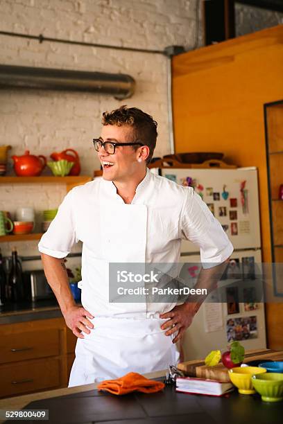 Handsome Chef Cooking In Modern Kitchen Stock Photo - Download Image Now - 25-29 Years, Adult, Adults Only