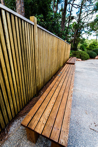 istock Wooden Fence with a Bench Next to it 529802739