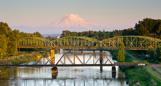 The Puyallup River meanders down from the glaciers on Mount Rainier under bridges through cities on it's way to Puget Sound