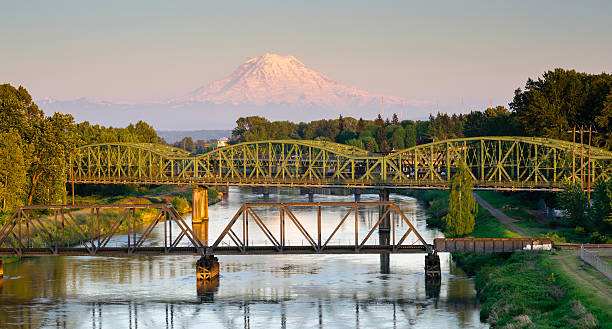 Railroad Car Bridges Puyallup River Mt. Rainier Washington The Puyallup River meanders down from the glaciers on Mount Rainier under bridges through cities on it's way to Puget Sound tacoma stock pictures, royalty-free photos & images
