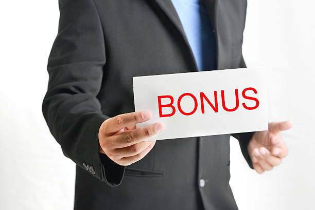 istock Man in suit giving an envelope  of  Bonus 529805023