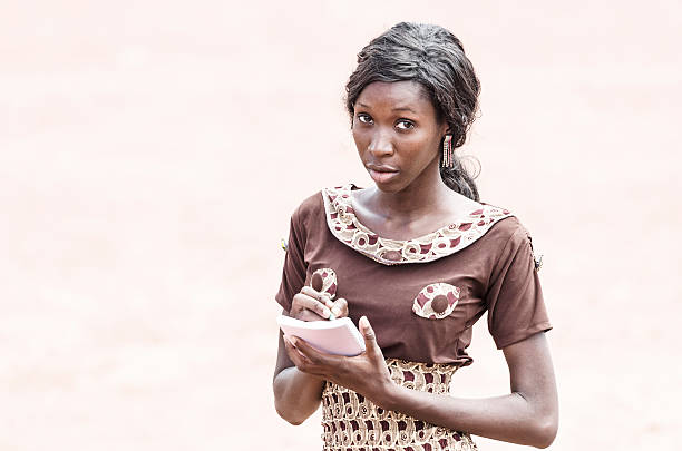 istock Isolated: African Note Pad Writing Symbol: African Woman Learning Reading 529806539