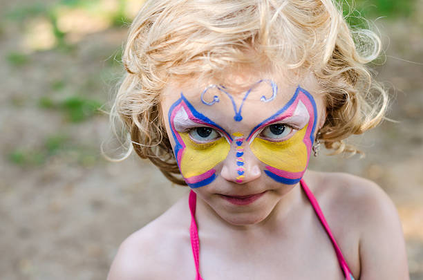 istock girl with face painting 529834869