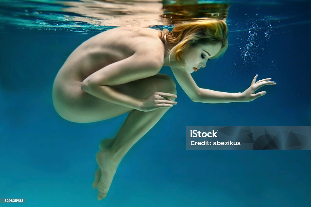 Girl in water Nude beautiful girl is under water Naked Stock Photo