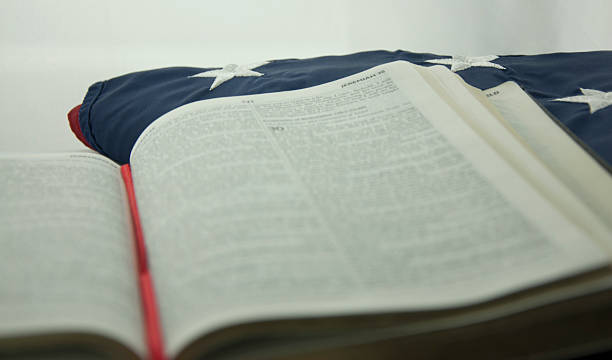 istock bible on the american flag 529836381