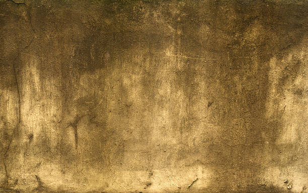 istock Texture of old wall covered with yellow stucco 529839001