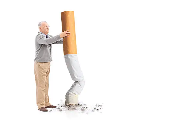 Senior putting out a giant cigarette isolated on white background