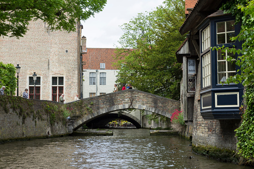 Bruges, Belgium - June 14, 2013: Canal in Bruges view from a boat.