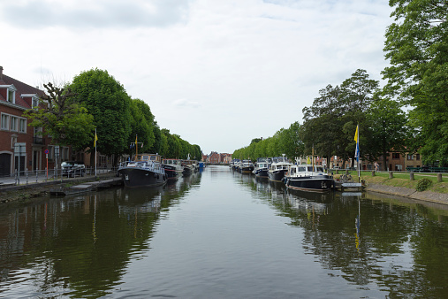 Bruges, Belgium - June 14, 2013: Canal with old boats in Bruges.