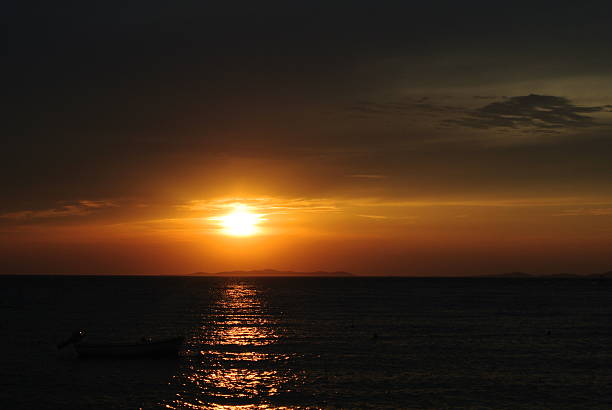 istock sunset over the island by night 529841275