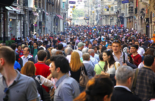 Istanbul, Turkey - May 5, 2012: People walking on Istiklal Street on May 5, 2012 in Istanbul, Turkey. It is the most famous street in Istanbul, visited by nearly 3 million people in a single weekends day