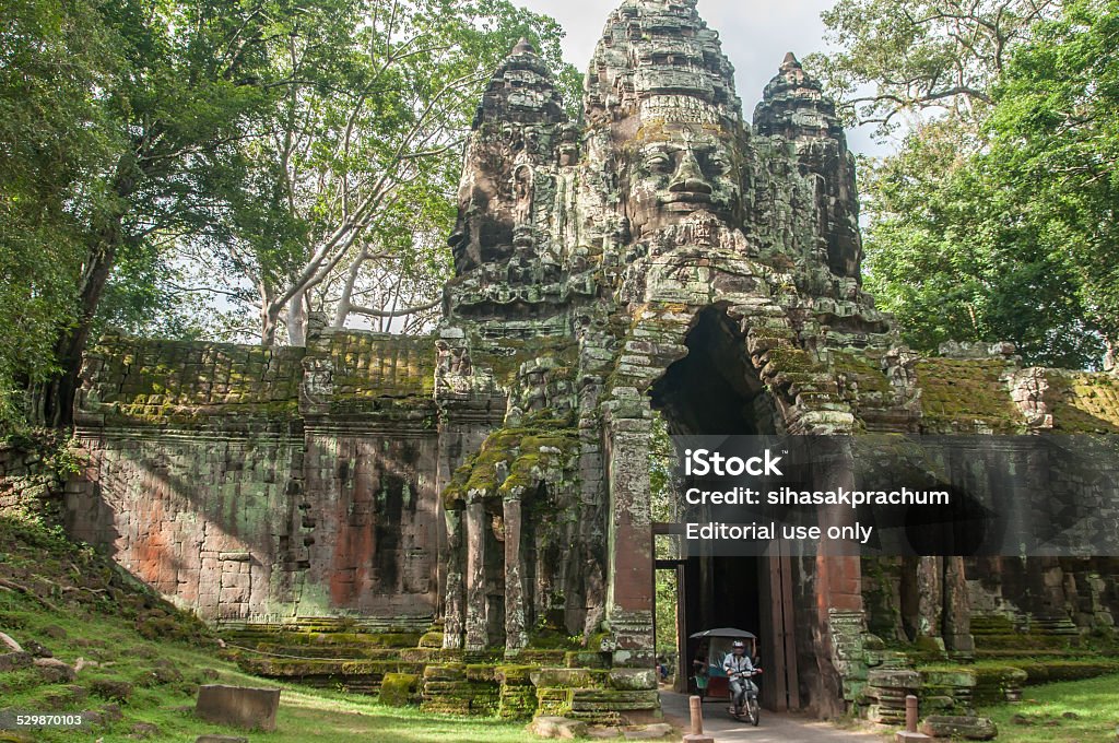 cambodia travel Siem Reap,Cambodia - October 04,2009 : The main transport TUKTUK at nortern gate of Angkor Thom in Siem Reap of Cambodia. Siem Reap is Cambodia's main tourist cities,World Seven Wonders of Angkor Wat in Siem Reap. Angkor Stock Photo