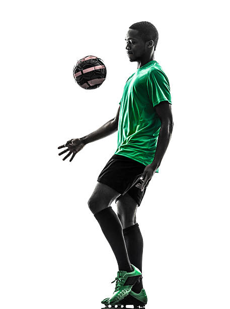 istock african man soccer player  juggling silhouette 529871575
