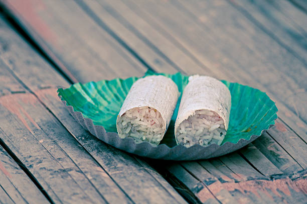 Rice steamed in bamboo tube served in a paper dish, Miao, arunachal Pradesh, India. Rice Cooked in Bamboo Tubes, also called Bamboo Rice or Fragrant Bamboo Rice, is a type of roasted food consisting of rice and some spices, contained in a bamboo tube. Generally, it is made by people who live in mountainous regions.