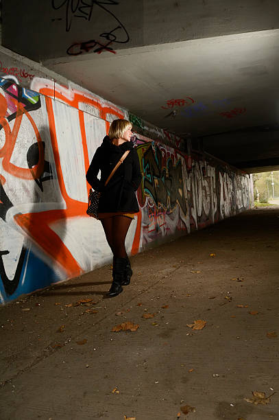 istock Frightened young woman alone in tunnel 529875593