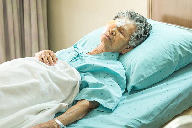 istock Elder female with eye patch sleeping after cataract surgery 529876053