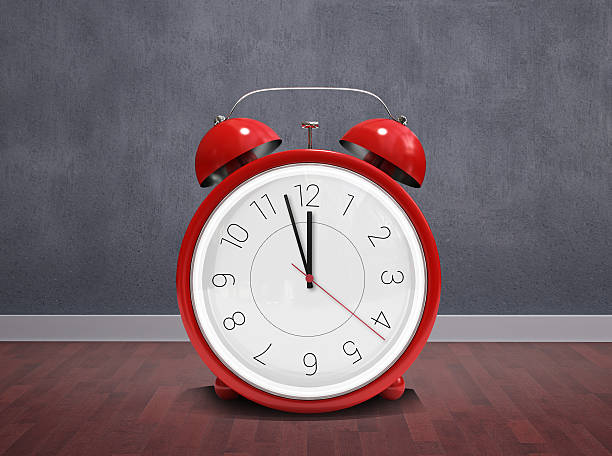 istock Composite image of alarm clock counting down to twelve 529898731