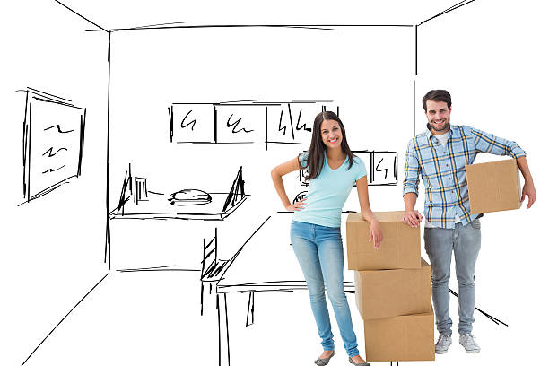 istock Composite image of attractive young couple with moving boxes 529899169