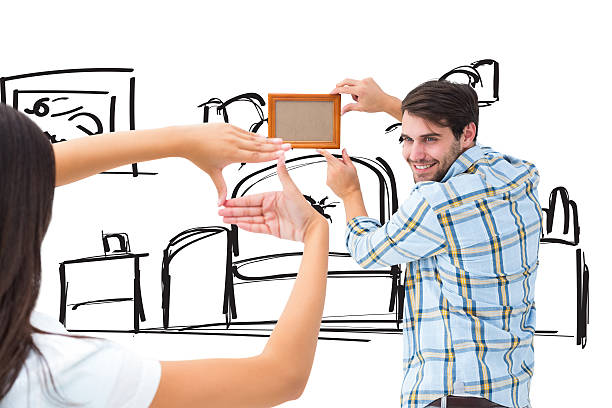istock Composite image of happy young couple putting up picture frame 529899245