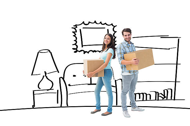 istock Composite image of happy young couple with moving boxes 529899253