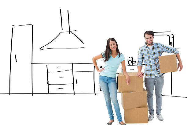 istock Composite image of attractive young couple with moving boxes 529899317