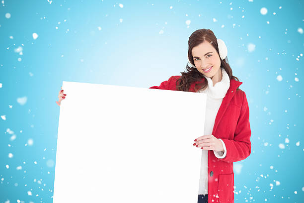 istock Composite image of happy brunette showing white poster 529900109