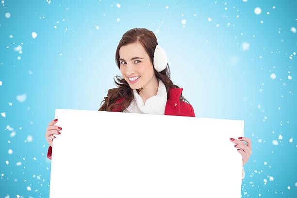 istock Composite image of beautiful brunette showing white poster 529900113