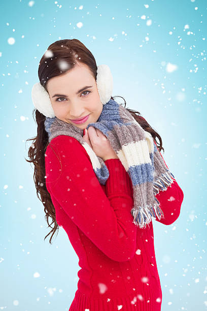 istock pretty brunette in winter wear smiling at camera 529900387