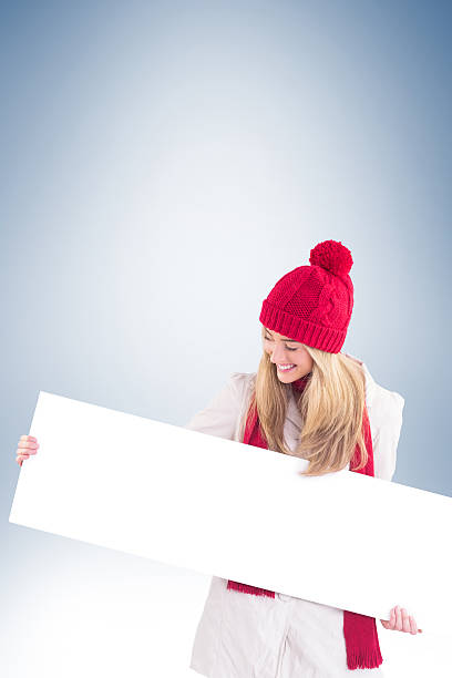 istock Pretty blonde showing white banner 529900579
