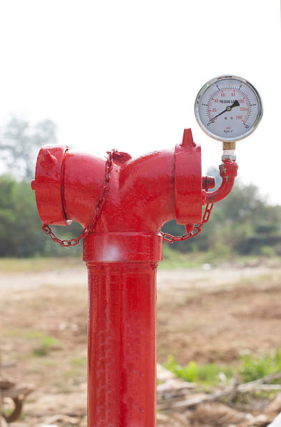 istock red metallic fire hydrant with pressure gauge or Fire Department 529900919
