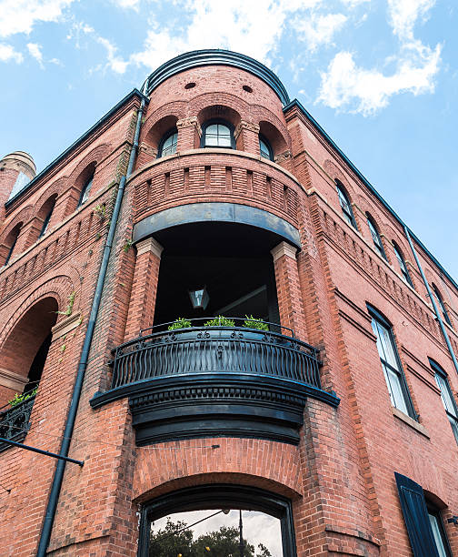 istock Black Iron Balcony on Old Brick Building 529902259