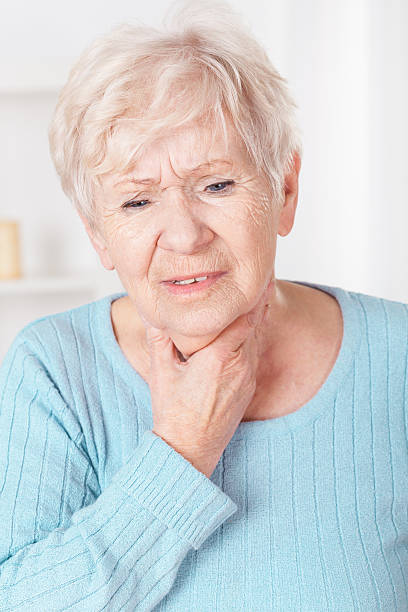 istock Woman with sore throat 529914471